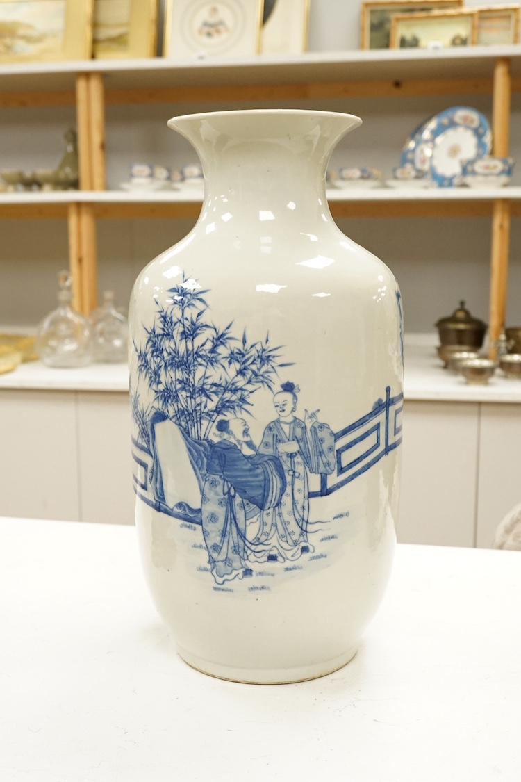 A large Chinese blue and white figural vase. 46cm high. Condition - large crack through from top to bottom of vase.